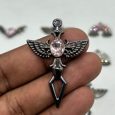 Black gothic wings pink stone cross pendant
