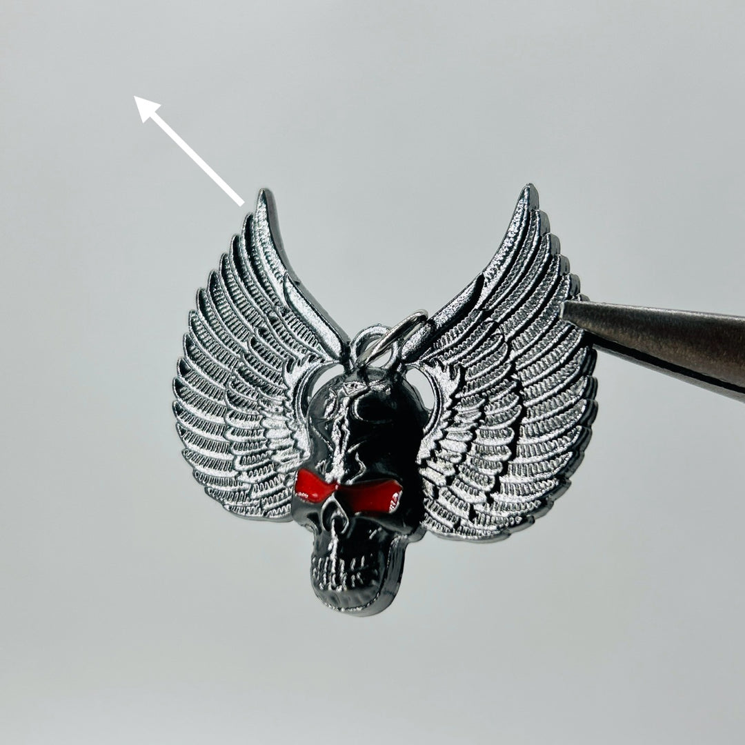 Black skull wings red eye