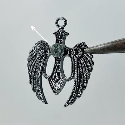 Black wings white stone pendant