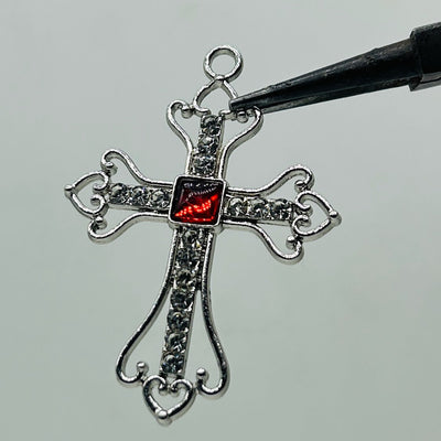 Silver iced out red square stone cross