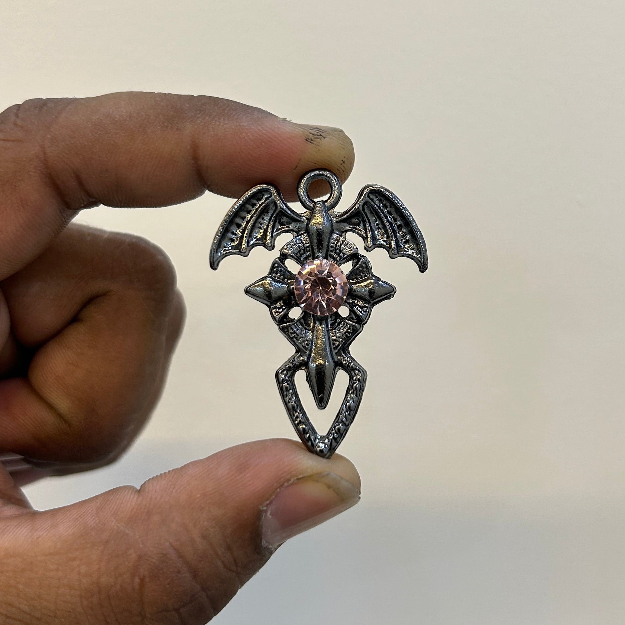 Black Dragon wings cross pink stone