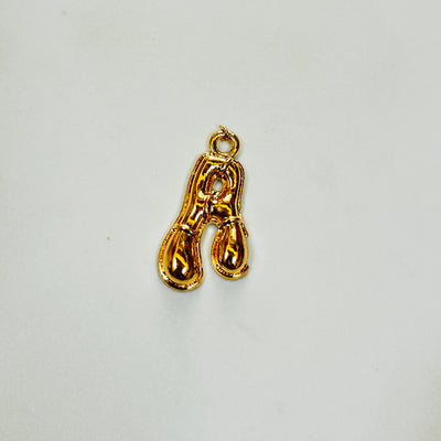 A gold alphabet charm