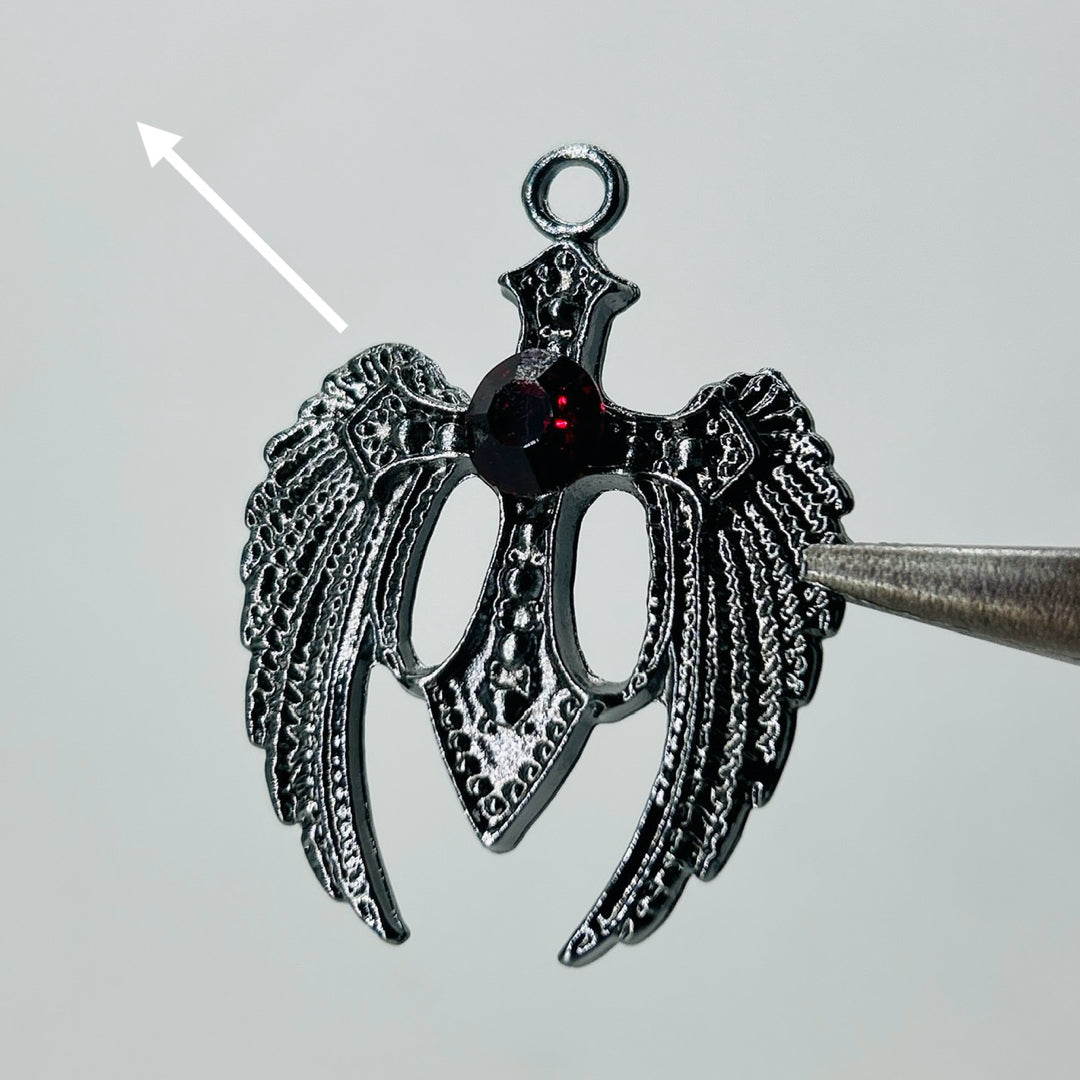 Black wings dark red stone pendant