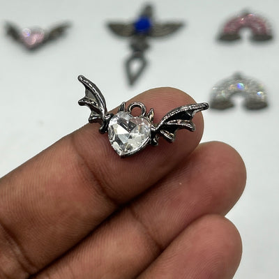 Black gothic batty white stone cross