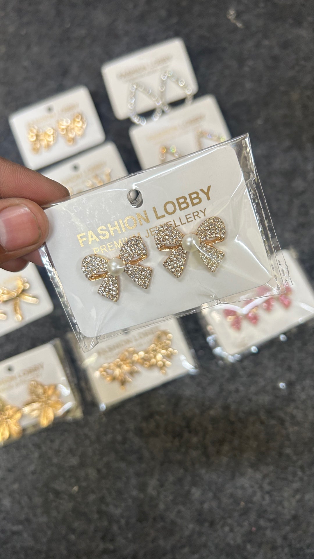 white gold iced bow earrings