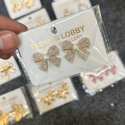 white gold iced bow earrings