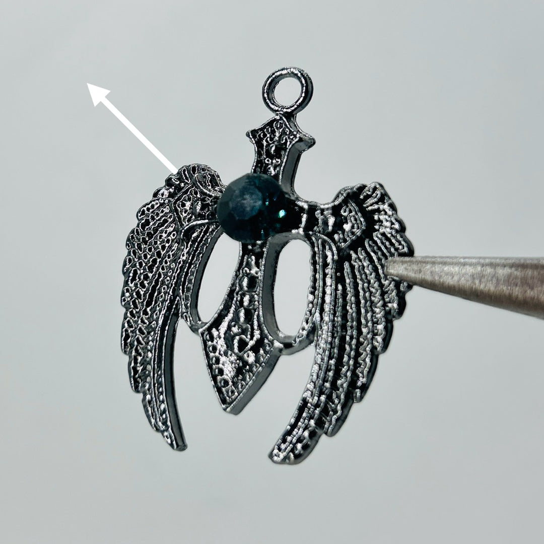 Black wings dark green stone pendant