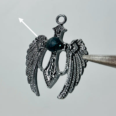 Black wings dark green stone pendant