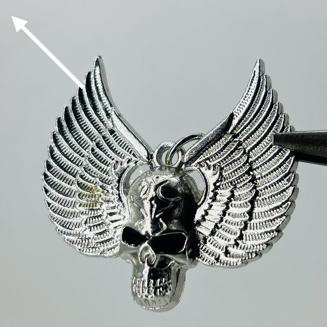 Silver black eye skull wings