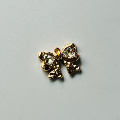 golden stone bow charms