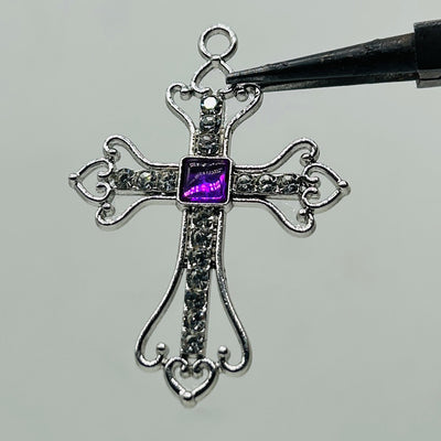 Silver iced out purple square stone cross