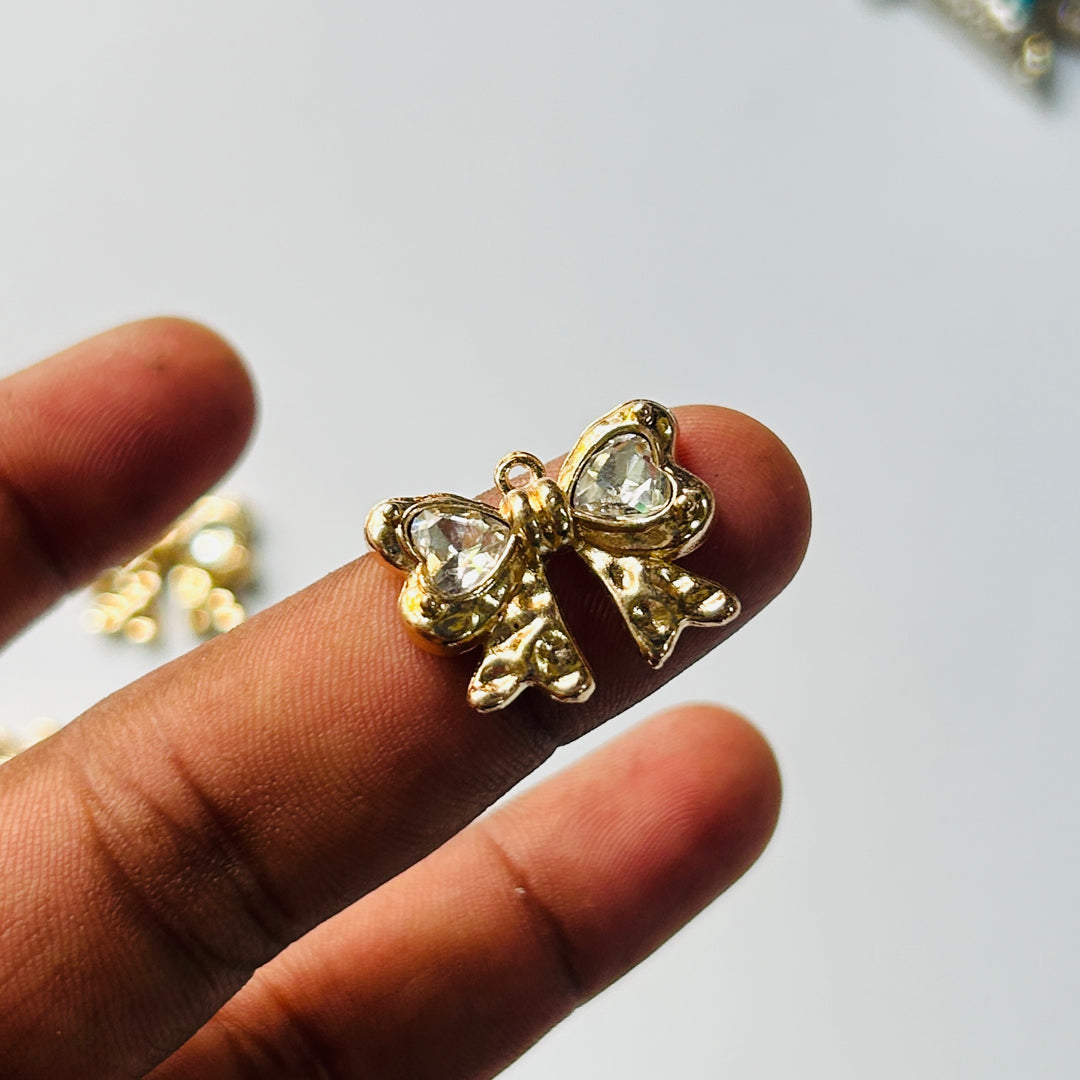 golden stone bow charms