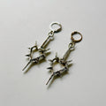 spick cross earrings
