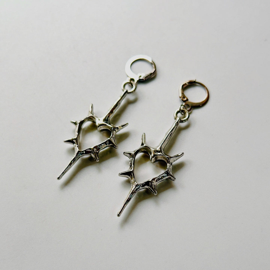 spick cross earrings