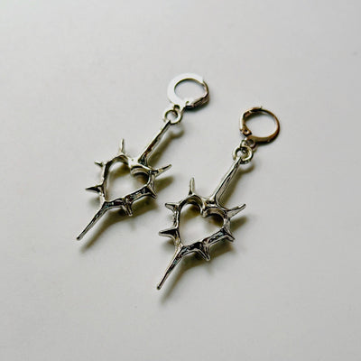 spick cross earrings