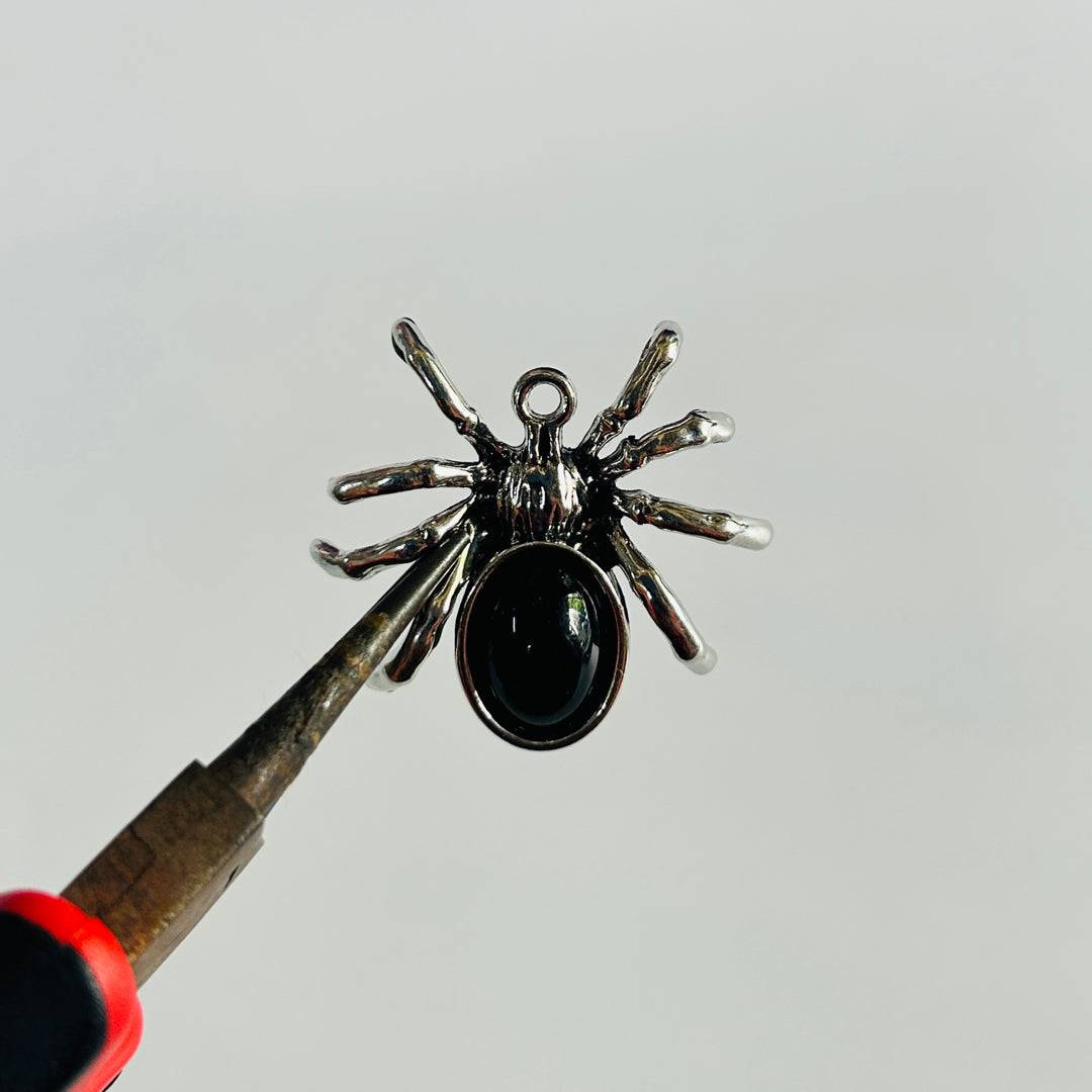 Black spider silver charms
