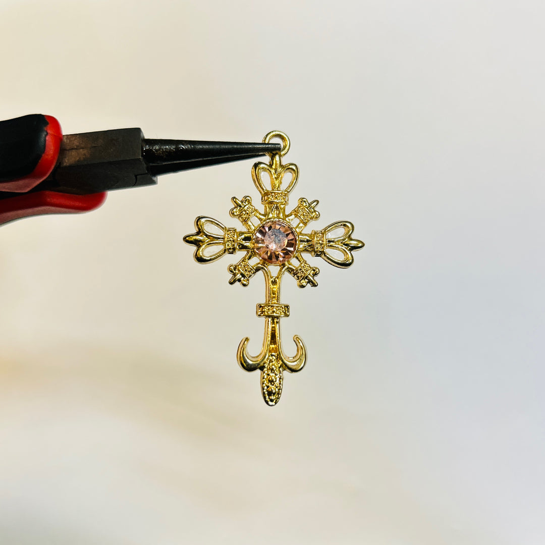 Gold pink stone cross
