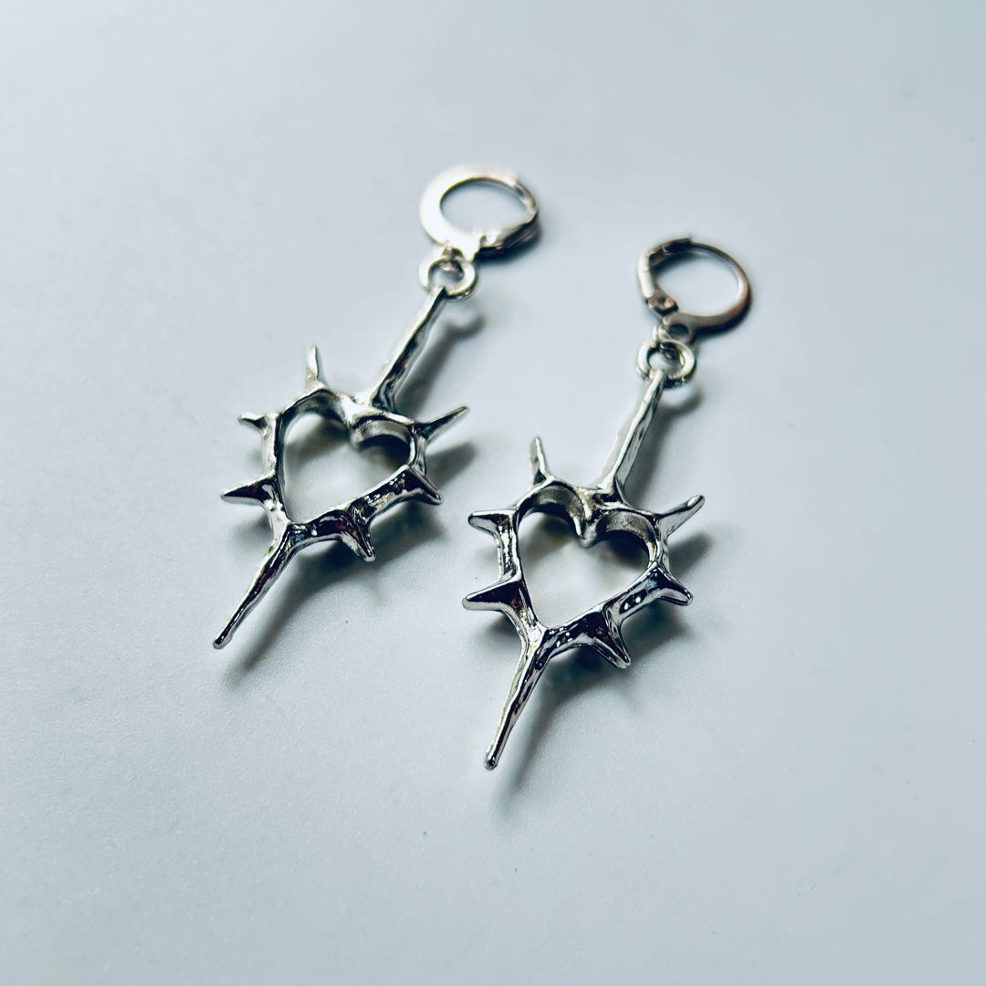 spick cross earrings