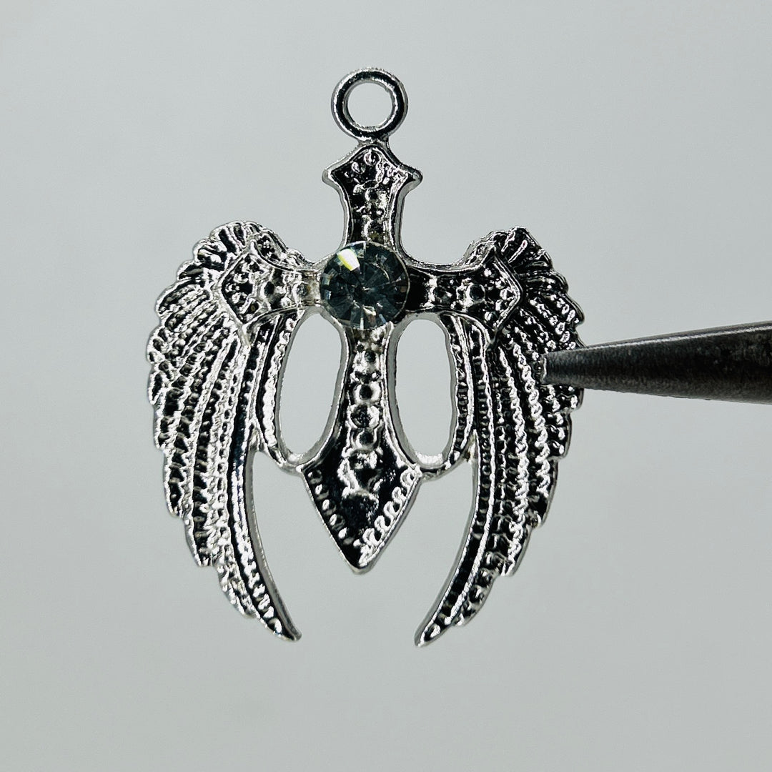 Silver wings dark green stone pendant