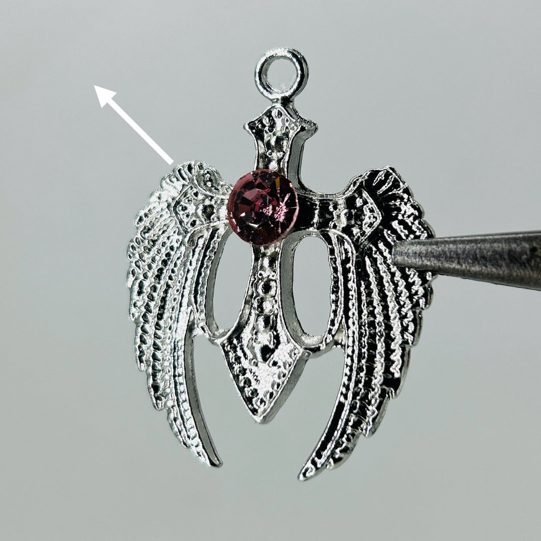 Silver wings pink stone pendant